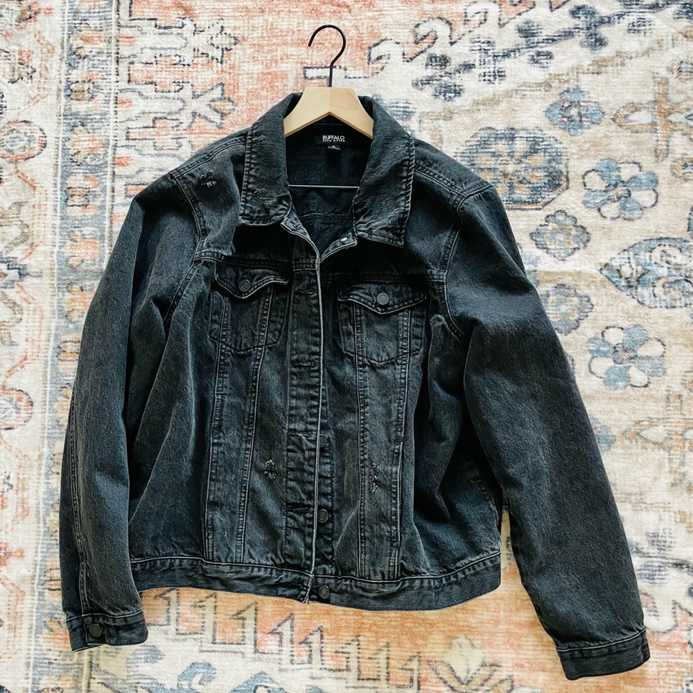 Black denim jacket with minor distressing. Perfect condition